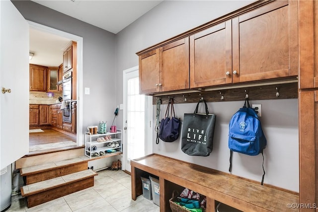 mudroom featuring light tile patterned floors