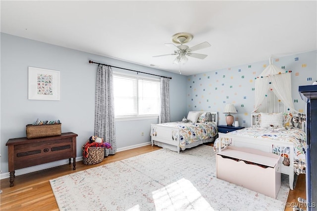 bedroom with hardwood / wood-style flooring and ceiling fan