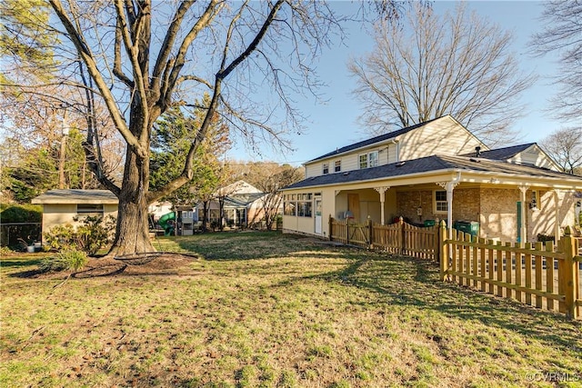 view of side of home featuring a yard