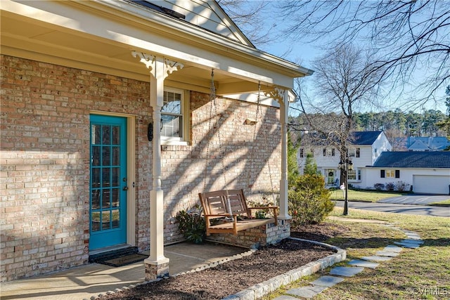 entrance to property featuring a porch