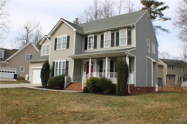 colonial home with a porch, a garage, central AC unit, and a front yard