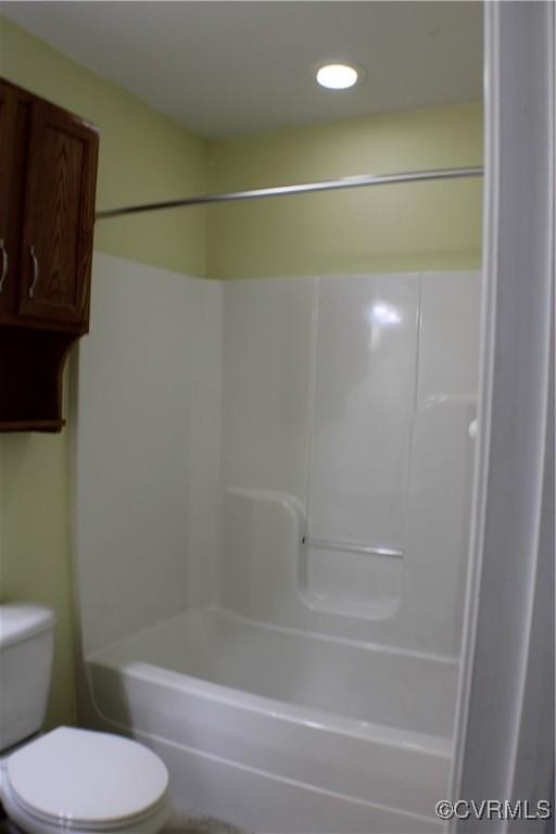 bathroom featuring  shower combination and toilet