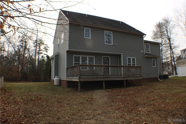 rear view of property with a wooden deck and central air condition unit