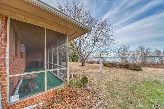 view of yard featuring a sunroom