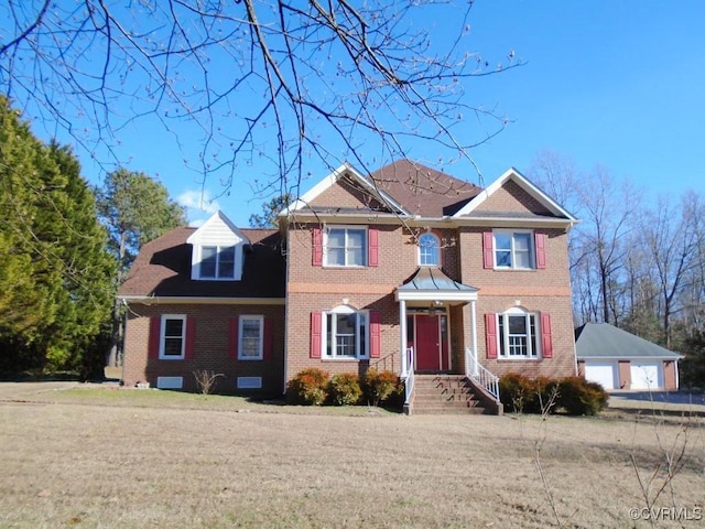 view of front of home featuring a garage and an outdoor structure