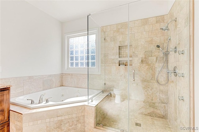 bathroom with shower with separate bathtub and toilet