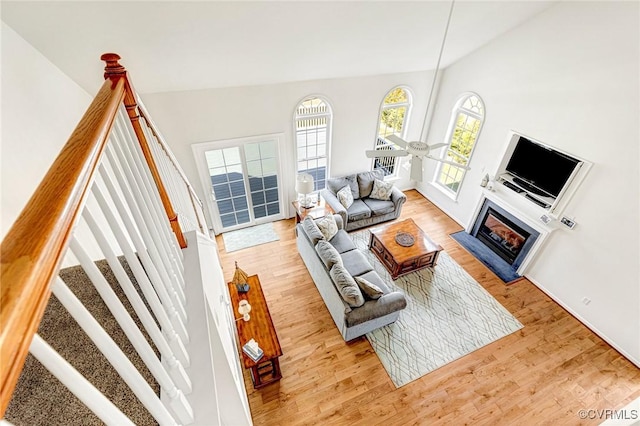 living room with vaulted ceiling and light hardwood / wood-style flooring