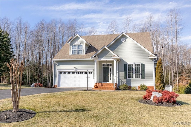 view of front of house with a garage and a front yard