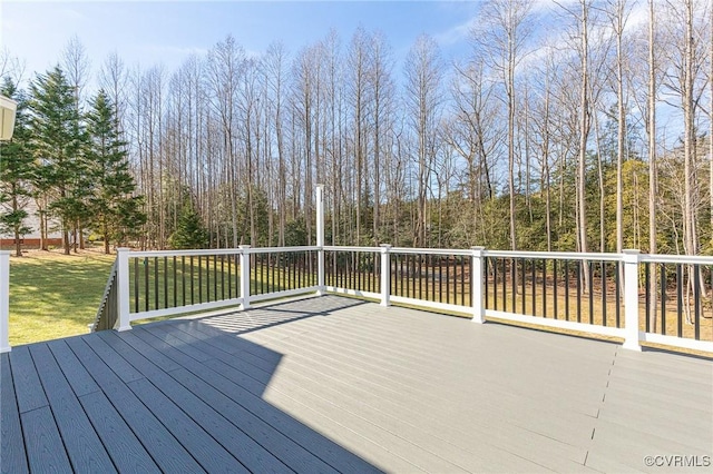 wooden terrace with a lawn