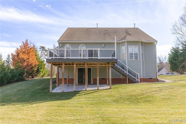 back of property featuring a wooden deck and a yard