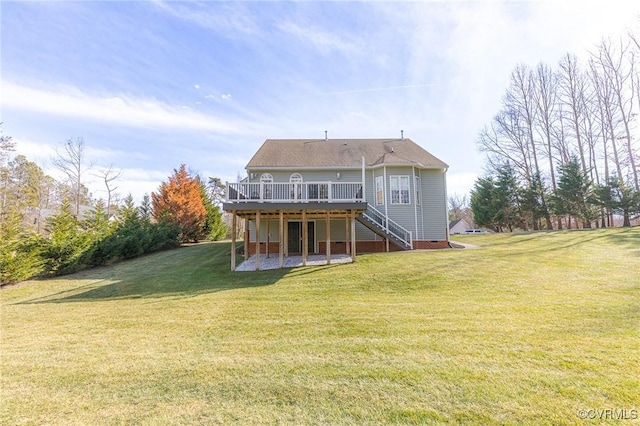 back of house featuring a wooden deck and a yard