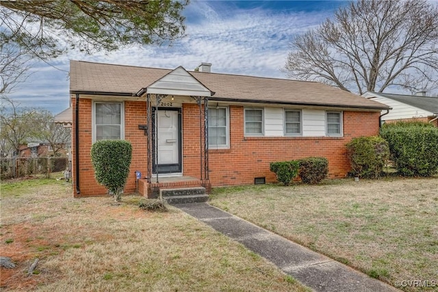 bungalow-style home with a front lawn