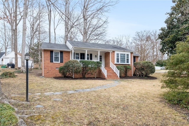 ranch-style home with a front lawn