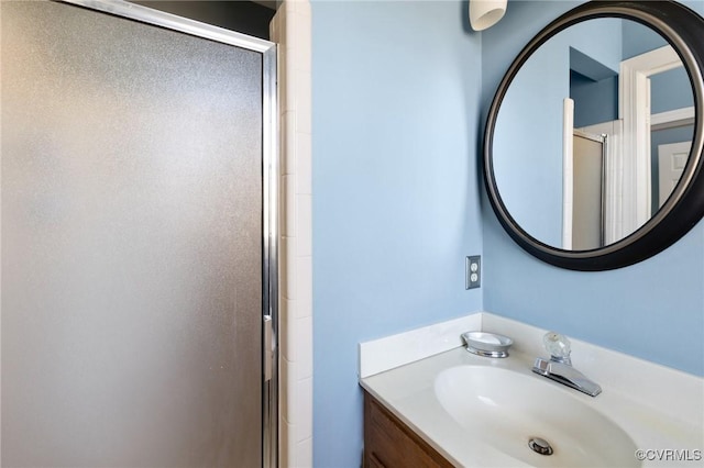 full bath featuring a shower stall and vanity