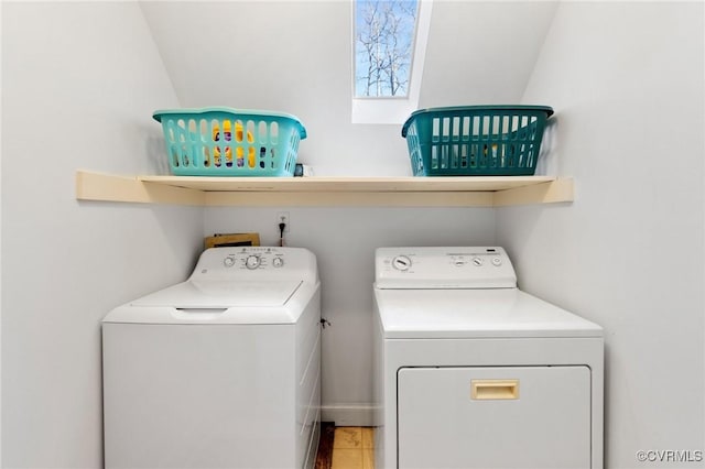 clothes washing area featuring laundry area and separate washer and dryer