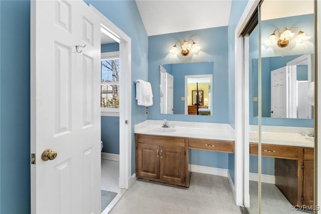 full bath featuring toilet, baseboards, and vanity