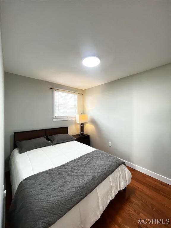 bedroom with wood-type flooring