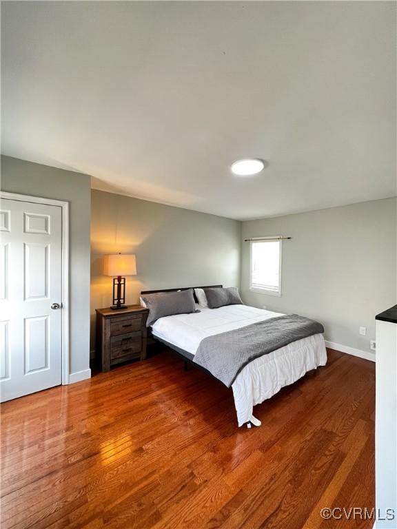 bedroom featuring dark hardwood / wood-style flooring