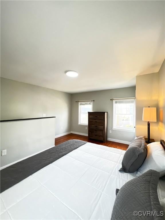 bedroom with hardwood / wood-style floors