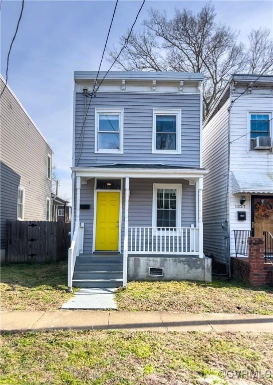 view of front of home featuring cooling unit and covered porch