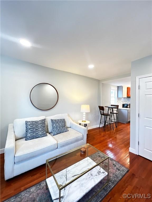 living room featuring dark hardwood / wood-style flooring