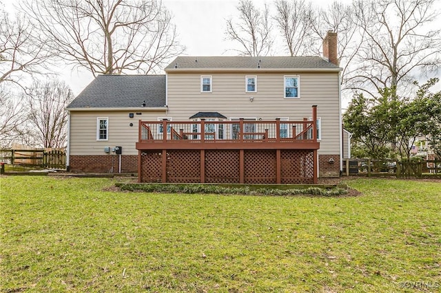 back of house with a fenced backyard, a chimney, and a lawn