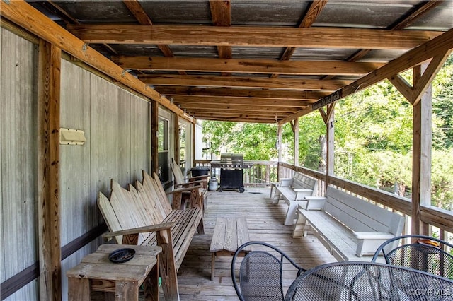 wooden terrace featuring area for grilling