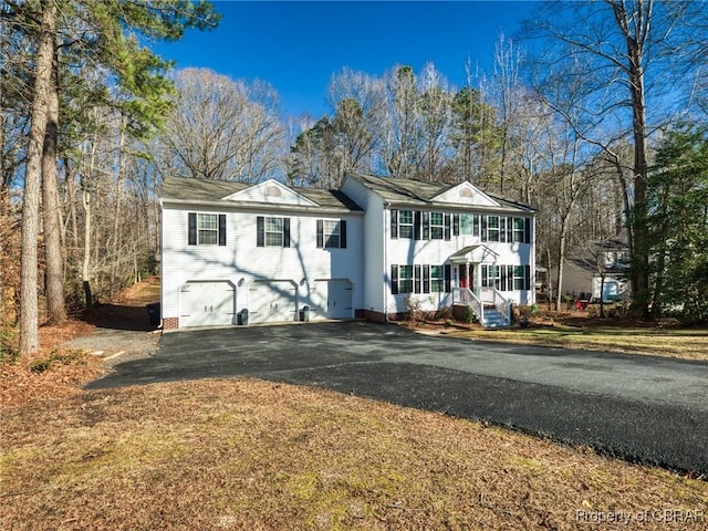 view of front of property featuring a garage and driveway