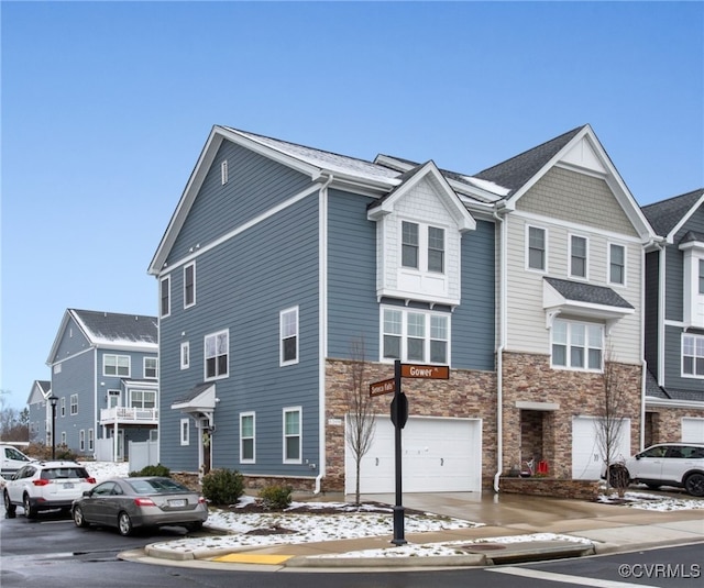 townhome / multi-family property featuring a garage