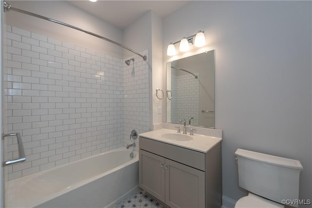 full bathroom featuring vanity, toilet, and tiled shower / bath combo