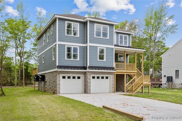8280 Mobjack Ln, Hayes, VA 23072 - view of front of property featuring driveway, a standing seam roof, an attached garage, a porch, and a front lawn