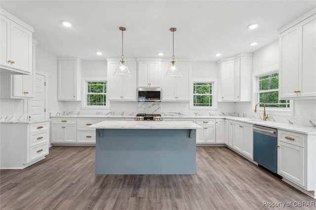 8280 Mobjack Ln, Hayes, VA 23072 - kitchen featuring stainless steel microwave, white cabinets, a sink, dishwasher, and wood finished floors