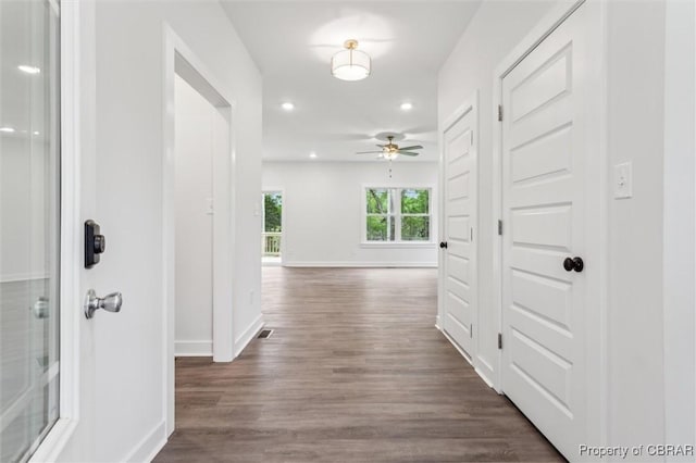 8280 Mobjack Ln, Hayes, VA 23072 - corridor with dark wood finished floors, baseboards, visible vents, and recessed lighting