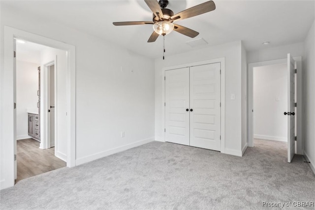 8280 Mobjack Ln, Hayes, VA 23072 - unfurnished bedroom with baseboards, ceiling fan, a closet, and carpet