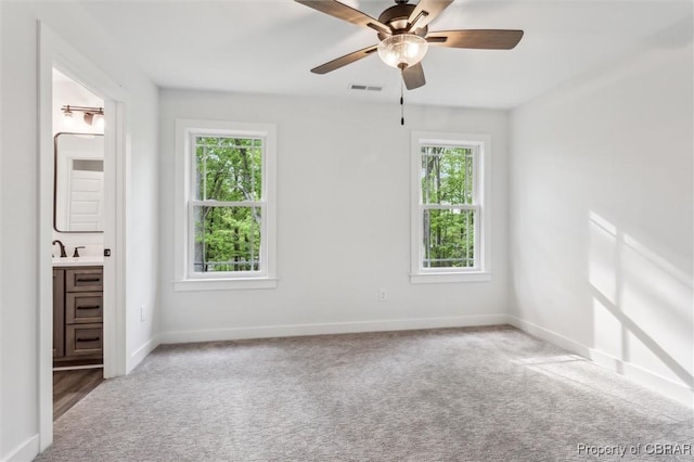 8280 Mobjack Ln, Hayes, VA 23072 - unfurnished bedroom with baseboards, visible vents, multiple windows, and carpet flooring