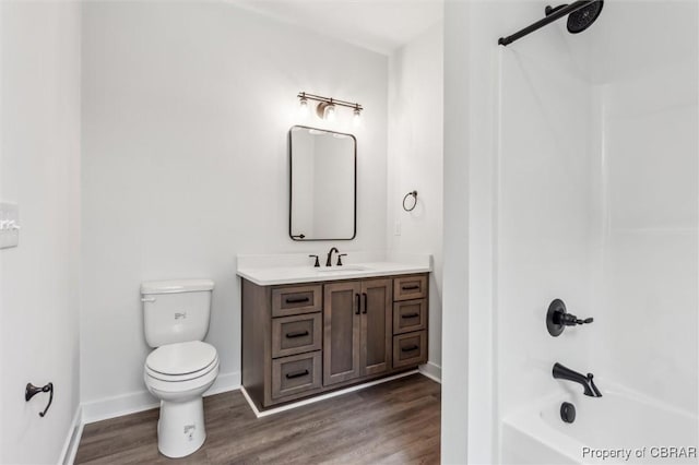 8280 Mobjack Ln, Hayes, VA 23072 - full bath with wood finished floors, toilet, shower / bath combination, vanity, and baseboards