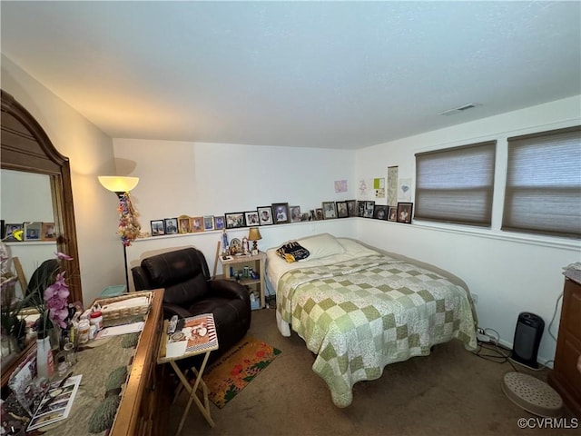 bedroom featuring visible vents and carpet flooring