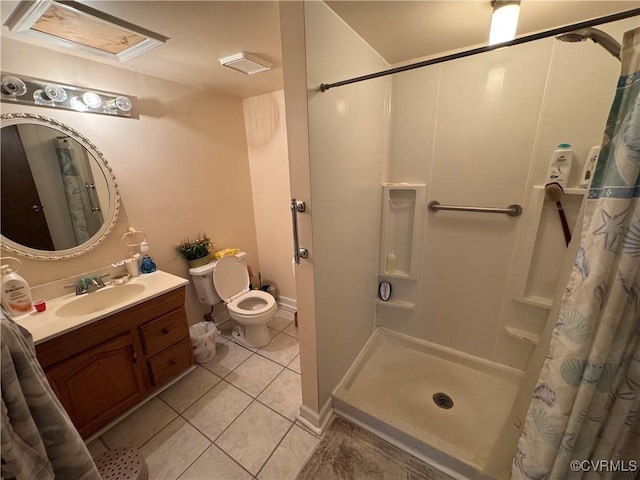 bathroom featuring toilet, a shower stall, vanity, and tile patterned floors