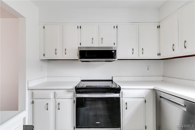 kitchen with white cabinets and appliances with stainless steel finishes