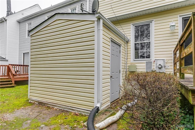 view of side of property with a deck