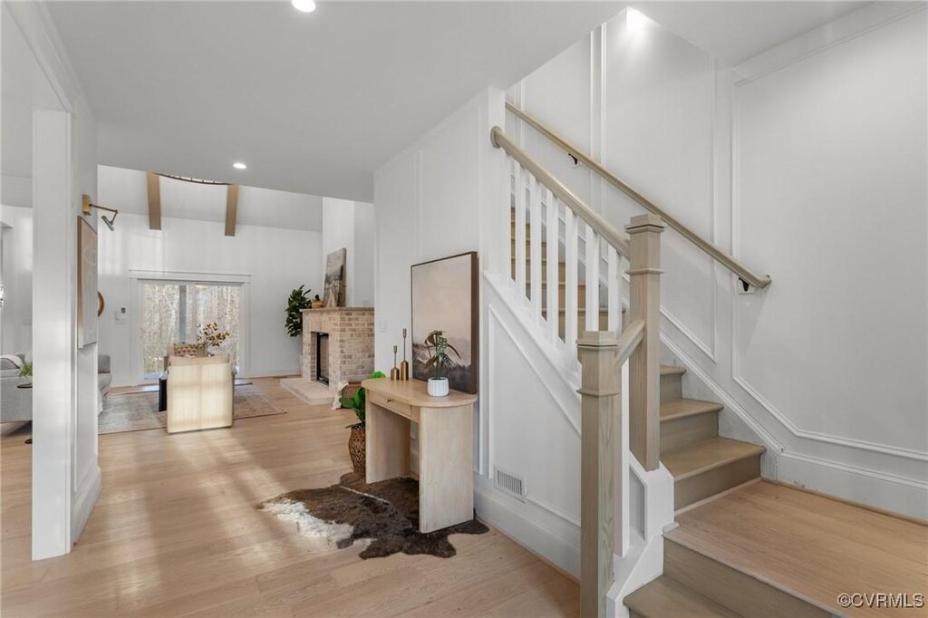 staircase with wood-type flooring