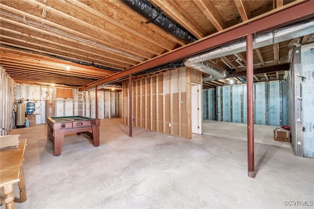 unfinished basement with billiards and electric water heater