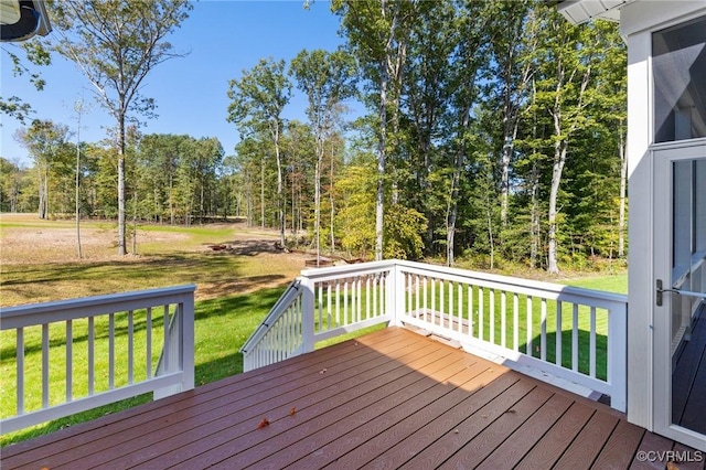 wooden deck with a lawn