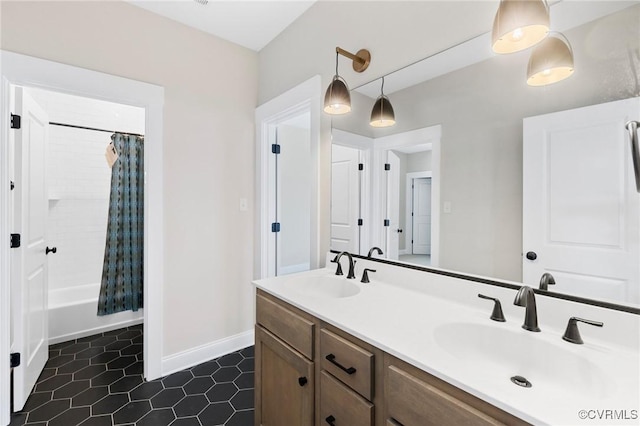 bathroom with vanity and shower / bath combo with shower curtain