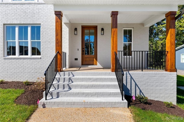 property entrance featuring covered porch