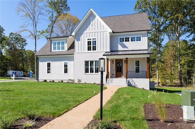 view of front of home featuring a porch and a front lawn