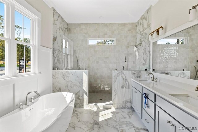 bathroom featuring vanity, tile walls, and separate shower and tub