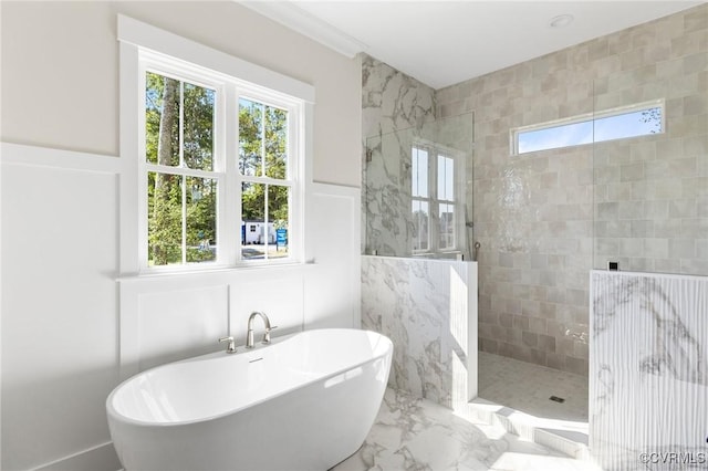 bathroom featuring plus walk in shower, tile walls, and a wealth of natural light