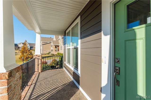 balcony featuring a residential view and a porch