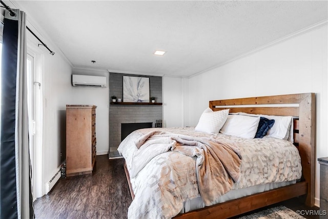 bedroom with baseboard heating, ornamental molding, a brick fireplace, an AC wall unit, and wood finished floors